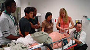 REACH students learning from nurse