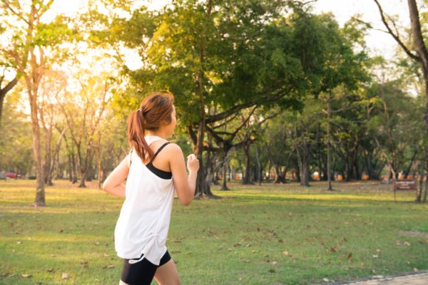 young woman running in park